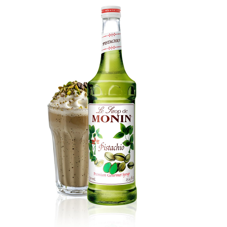 Monin Pistachio Syrup bottle pour enhances coffee with a rich pistachio note.