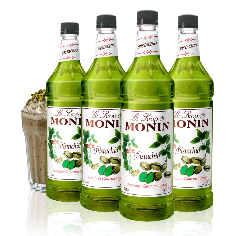 Monin Pistachio Syrup bottle pour enhances coffee with rich nutty aroma.