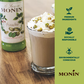 Monin Pistachio Syrup glass dispense shows BPA-free packaging and easy topping.