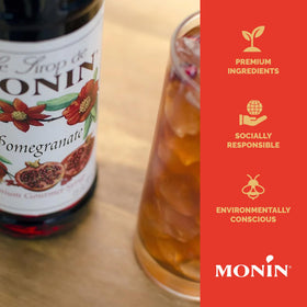 Monin Pomegranate Syrup cocktail glass with tart-sweet flavor.