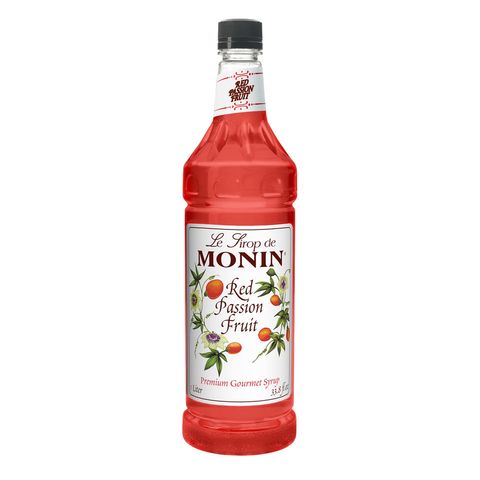 Monin Red Passion Fruit syrup bottle pour showing vibrant color ideal for tropical cocktails.
