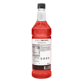 Monin Red Passion Fruit syrup in a tropical cocktail glass, adding color and fruit-forward flavor.