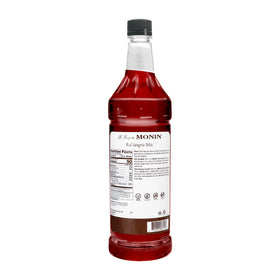 Monin Red Sangria Mix being poured into a glass for consistent sangria