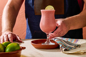 Close-up of Monin Strawberry Fruit Smoothie Mix label, ideal for cafe-style strawberry drinks.
