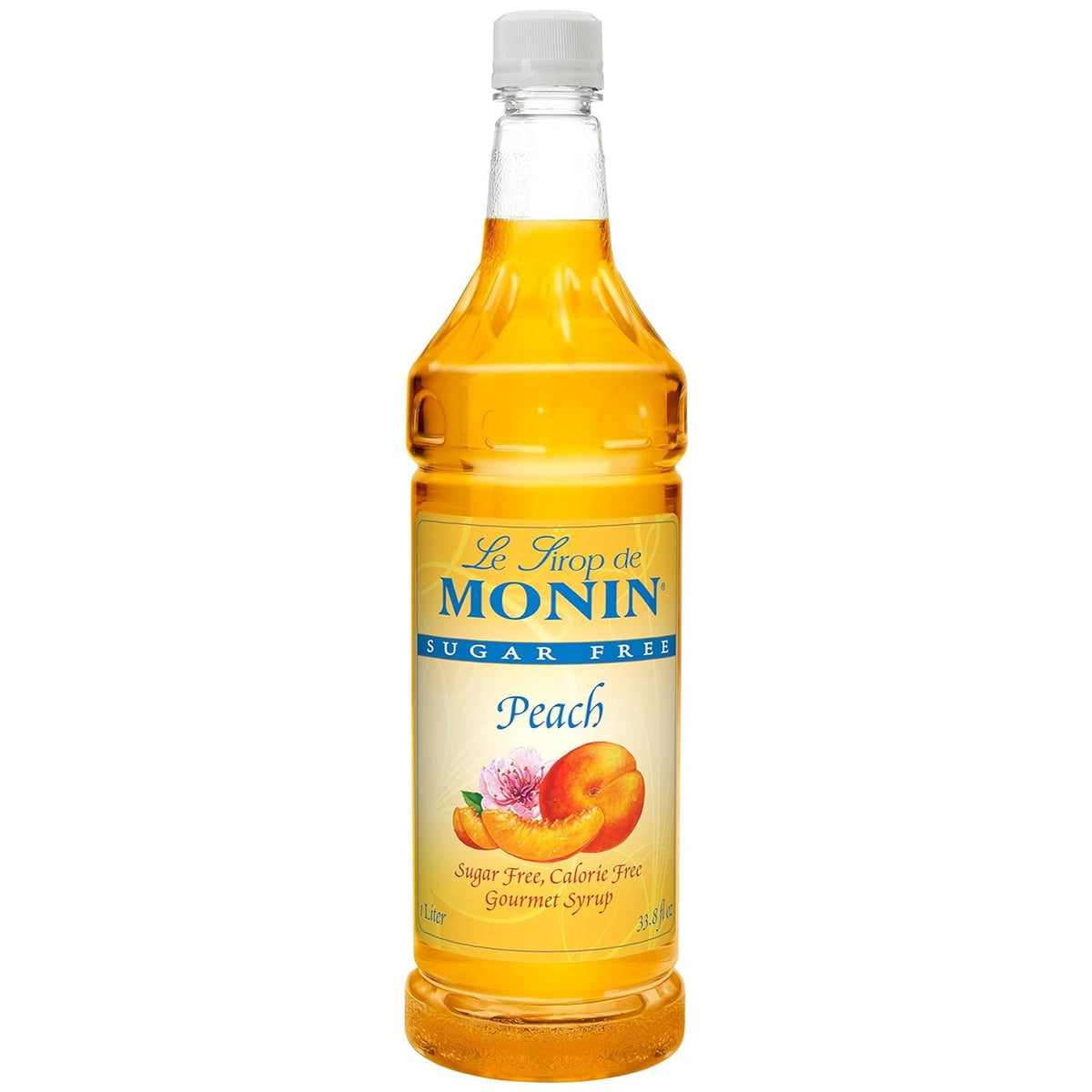 Monin Sugar-Free Peach bottle on counter ideal for a home bar setup