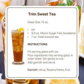 Monin Sugar-Free Sweetener cocktail mixer in a glass, versatile for cocktails.