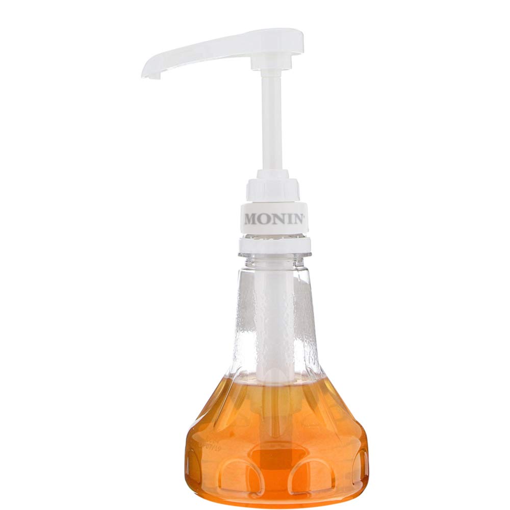 Monin pump demonstrates leak-proof design on a white setup.