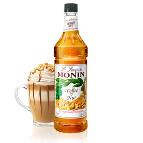 Monin Toffee Nut Syrup bottle closeup for rich coffee flavor enhancement.