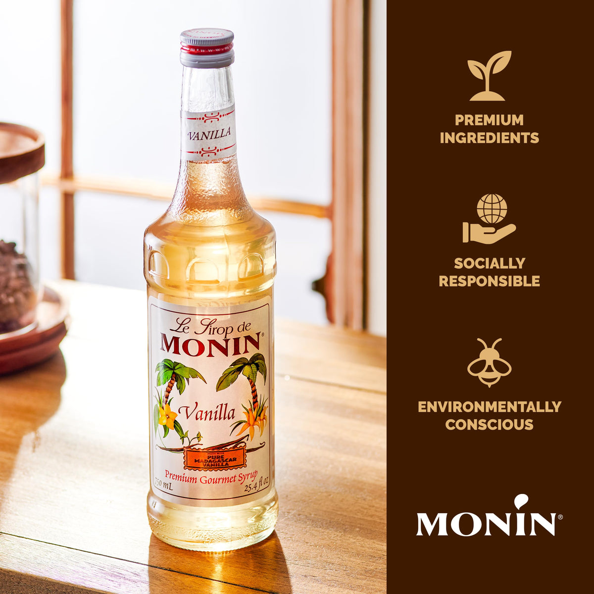 Monin Vanilla Syrup drizzle over a coffee cup highlights indulgent aroma.