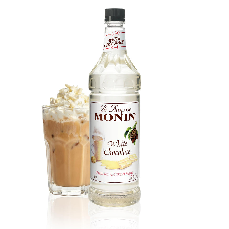 Monin White Chocolate Syrup bottle on a counter, ready to elevate lattes.