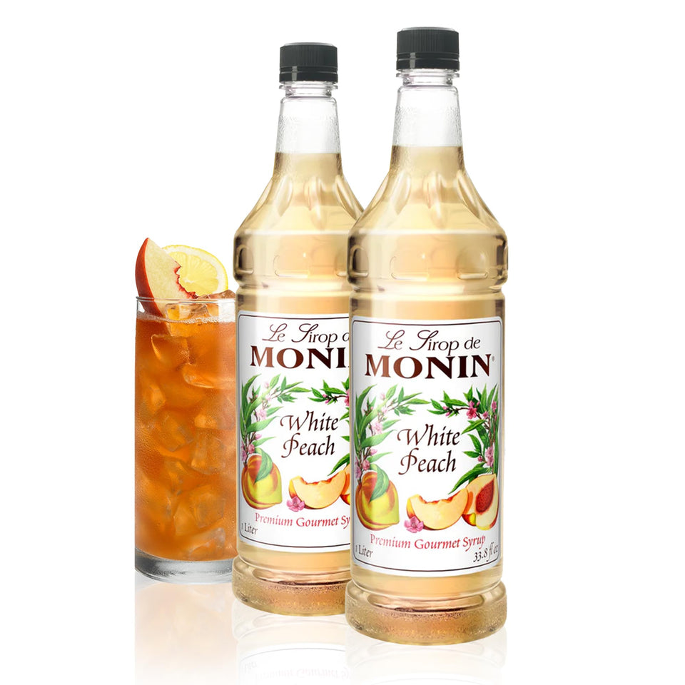 Monin White Peach Syrup bottle showcasing peach flavor for cocktails