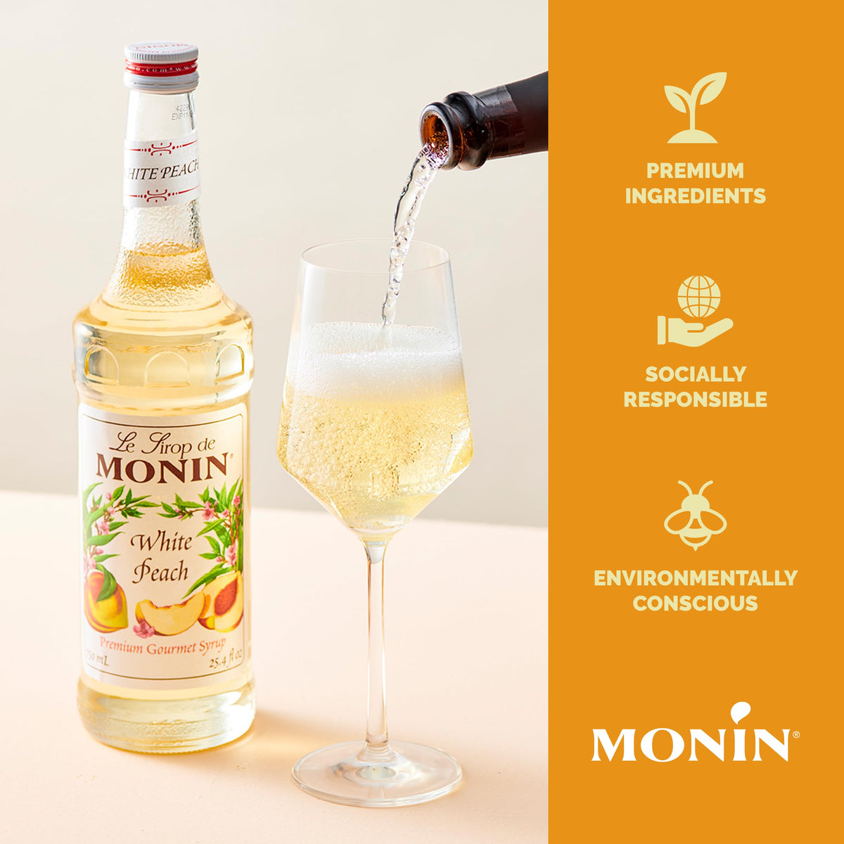 Iced tea tinted peach with Monin White Peach Syrup for a bright sip.