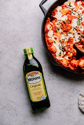 Monini Originale olive oil label closeup emphasizing IGP quality from Modena, Italy