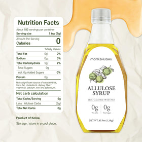 MONKSHUSHU Allulose Syrup being poured into a drink for keto friendly sweetness