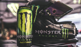 Monster Energy Nitro Super Dry citrus flavor visual with golden hue and zest