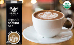 Mooala Barista Oatmilk beside matcha cup for creamy drinks.