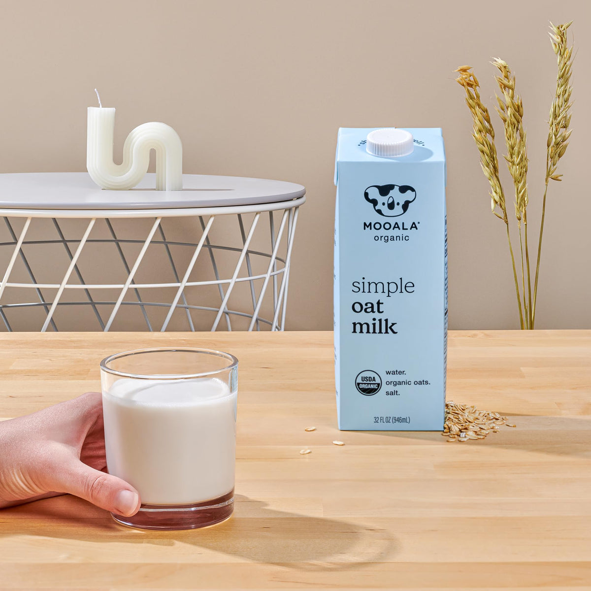 Mooala milk being poured into glass, showing creamy texture