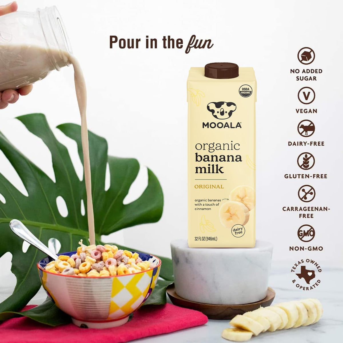 Glass of Mooala Banana Milk with bananas, highlighting a calcium and potassium option.