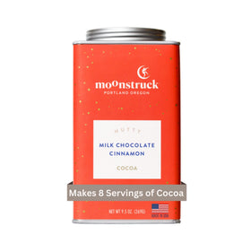 Moonstruck cinnamon and almond hot cocoa mix in a reusable tin for cozy evenings.