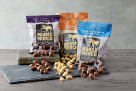 Moose Munch Premium Popcorn Trio: dark chocolate option adds rich flavor for sophisticated snacking.