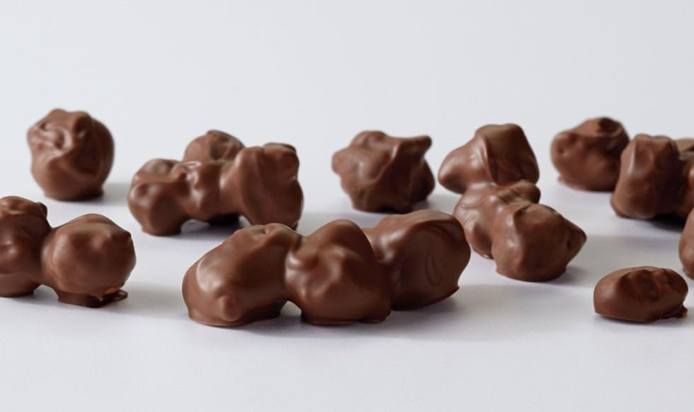 Moose Munch Premium Popcorn Trio: milk chocolate variety enhances movie nights with a creamy crunch.