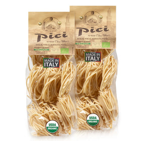Morelli Pici pasta nests on a rustic board, ideal with olive oil and tomato sauce