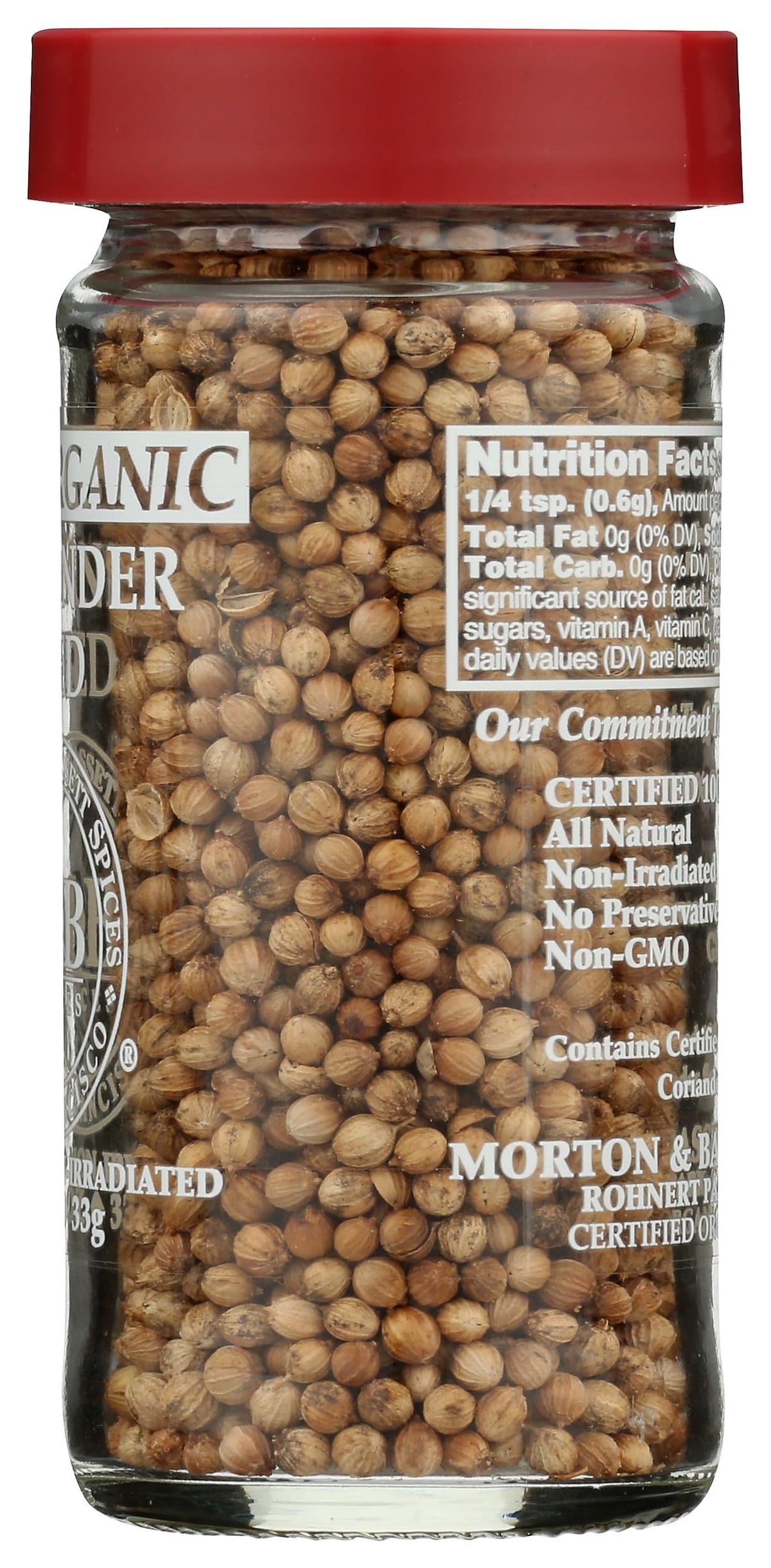 Pouring Morton & Bassett coriander seeds into a pan for flavor
