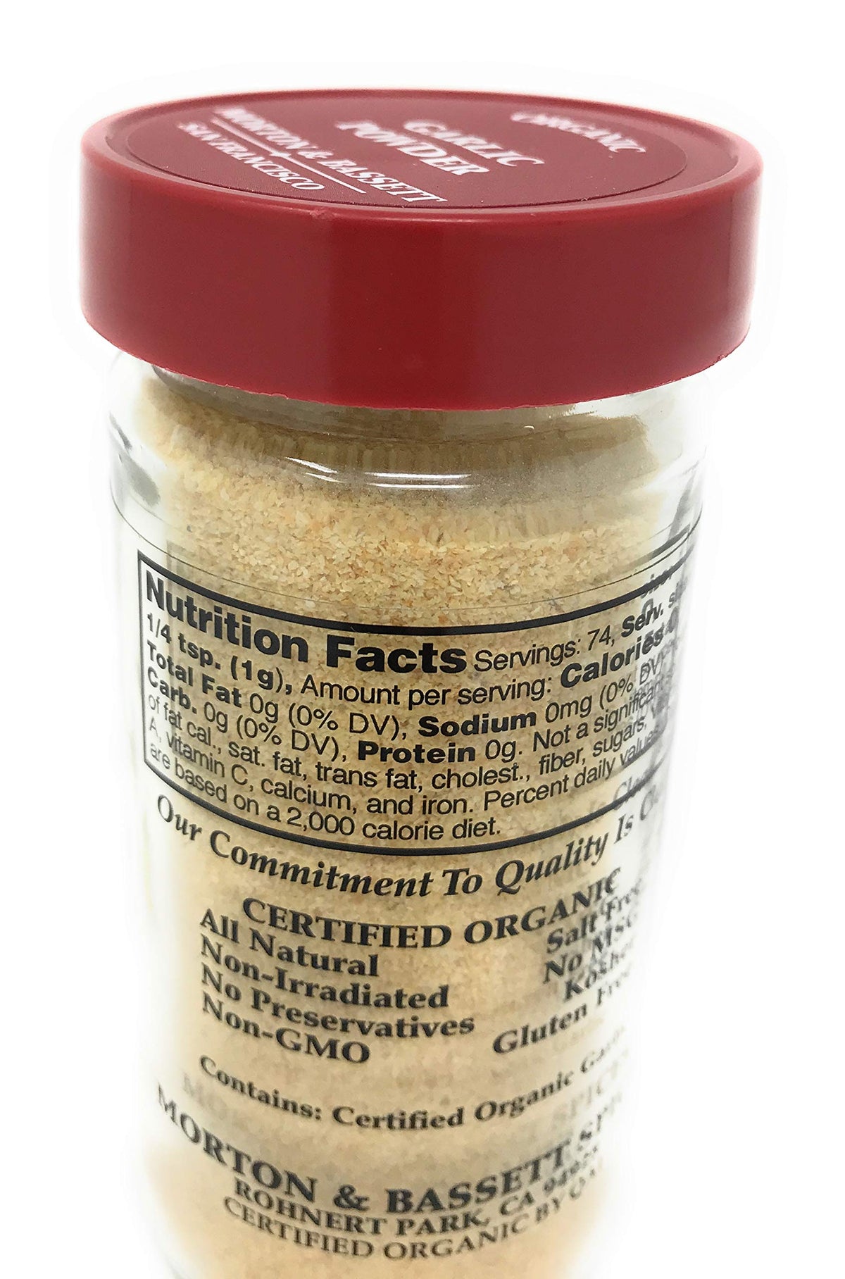 Morton & Bassett Organic Garlic Powder on kitchen rack with a tiny scoop for easy measuring.