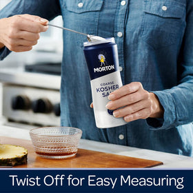 Morton Coarse Kosher Salt on counter beside spices for everyday cooking.