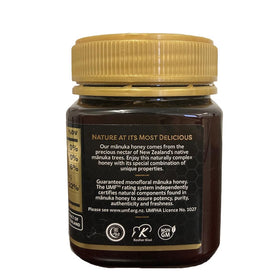Packaging of Mother Earth Manuka honey UMF10 shown in warm light.