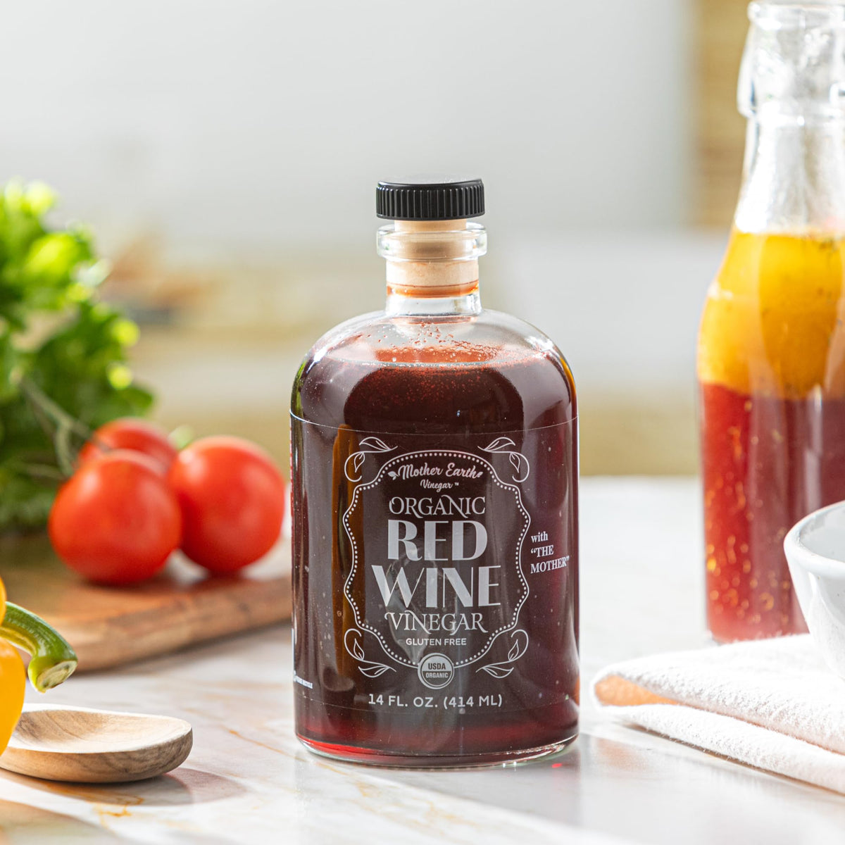 Removable stopper on Mother Earth Vinegar 14 oz bottle.