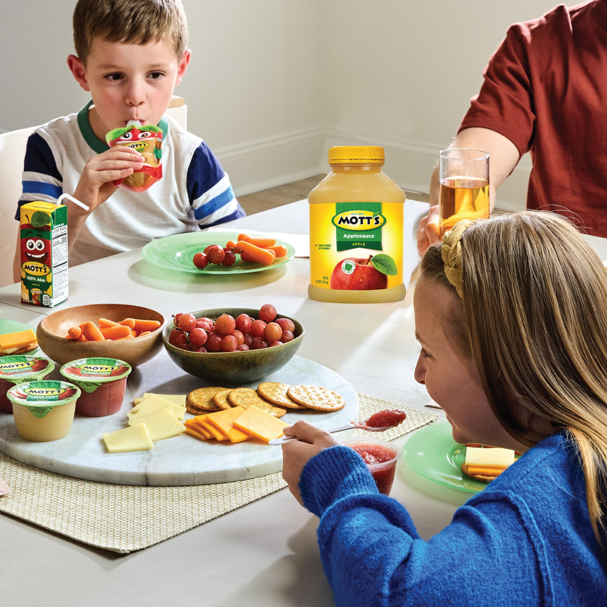 Pouring into a bowl shows easy serving at home with Mott's applesauce.