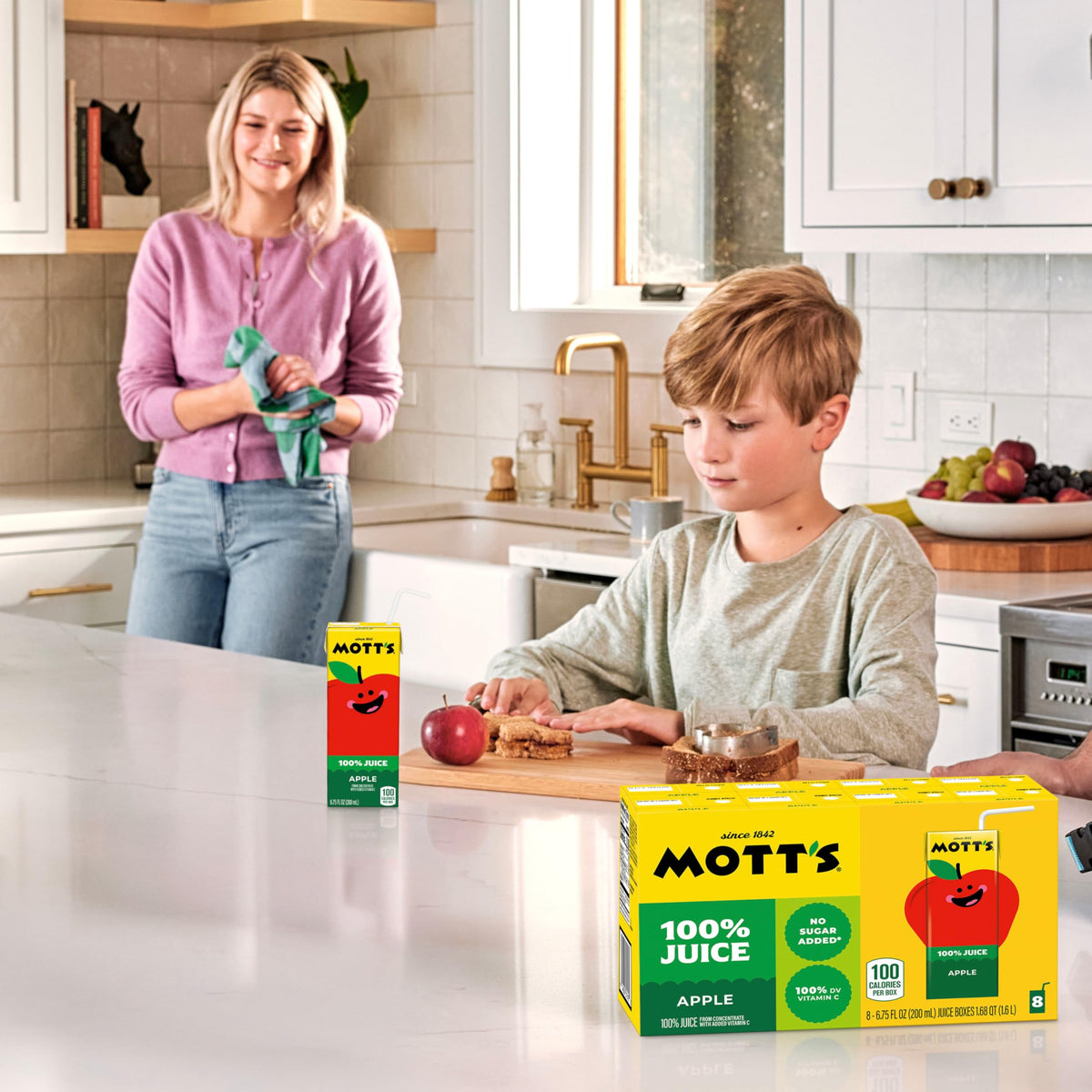 Family mealtime scene featuring Mott's Apple Juice boxes.