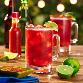 Mott's Clamato Preparado bottle 32oz front showcases a convenient party-size option.