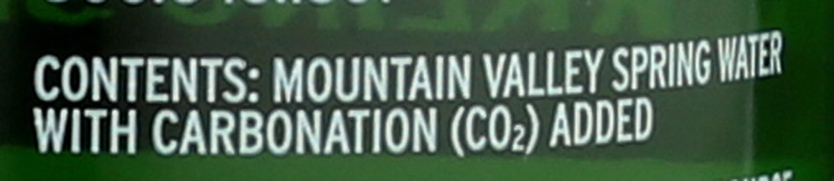 The Mountain Valley Sparkling Lime being poured, lively bubbles and zing.