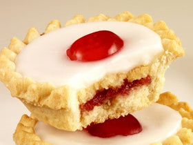 Mr Kipling Cherry Bakewells close-up, almond topping and cherry center.