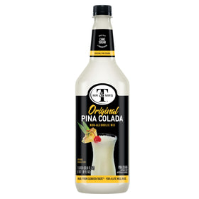 Polished glass with a Piña Colada cocktail using Mr & Mrs T.