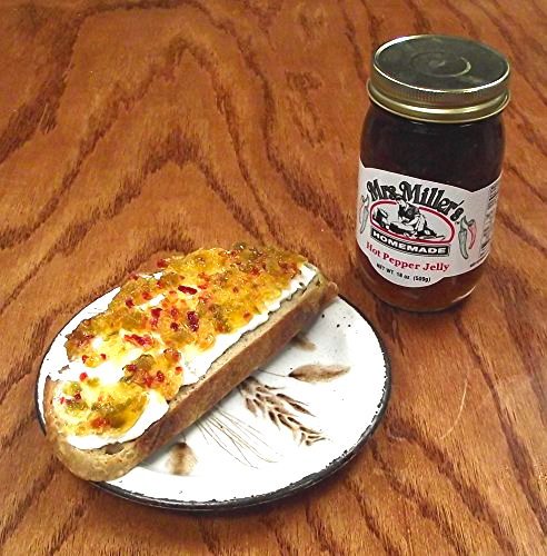 Cheese board featuring Mrs. Miller's hot pepper jelly pairing.