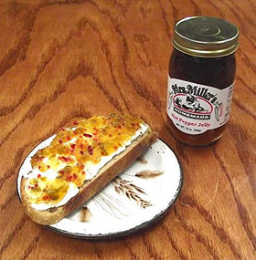 Cheese board featuring Mrs. Miller's hot pepper jelly pairing.
