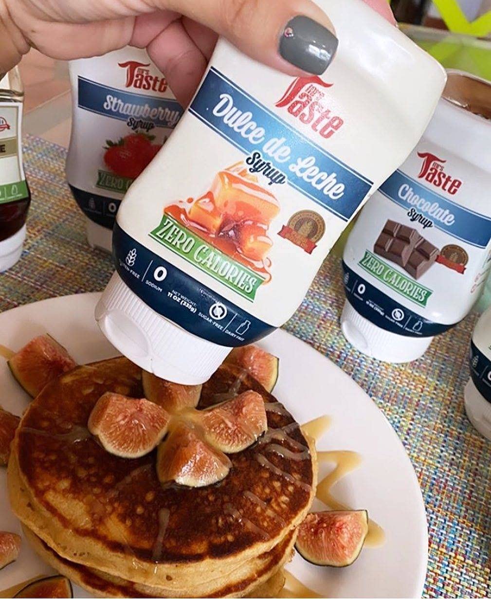 Pouring action shot of Mrs Taste Dulce de Leche bottle.