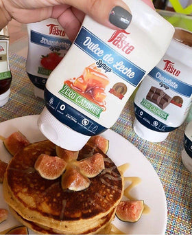 Pouring action shot of Mrs Taste Dulce de Leche bottle.