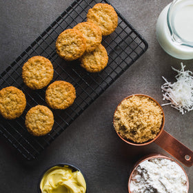 Mrs. Thinsters toasted coconut thins bite shot — crisp, coconut-scented sweetness.
