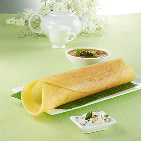 Dosas served with chutney and sambar for a complete breakfast.