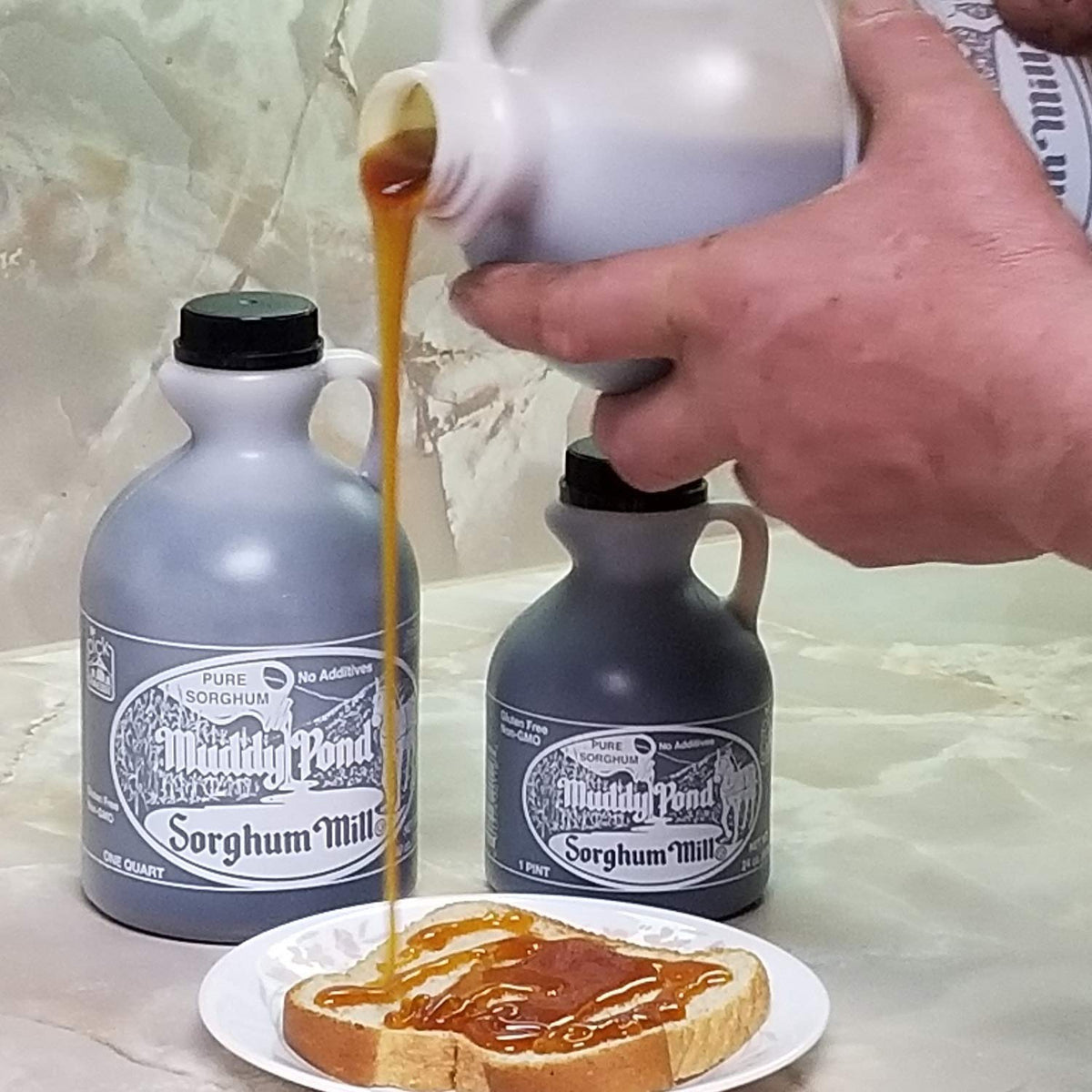 Muddy Pond Sorghum Mill pour shot over pancakes, natural sweetness for breakfast.