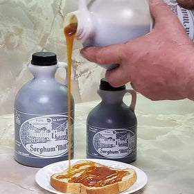 Muddy Pond Sorghum Mill pour shot over pancakes, natural sweetness for breakfast.