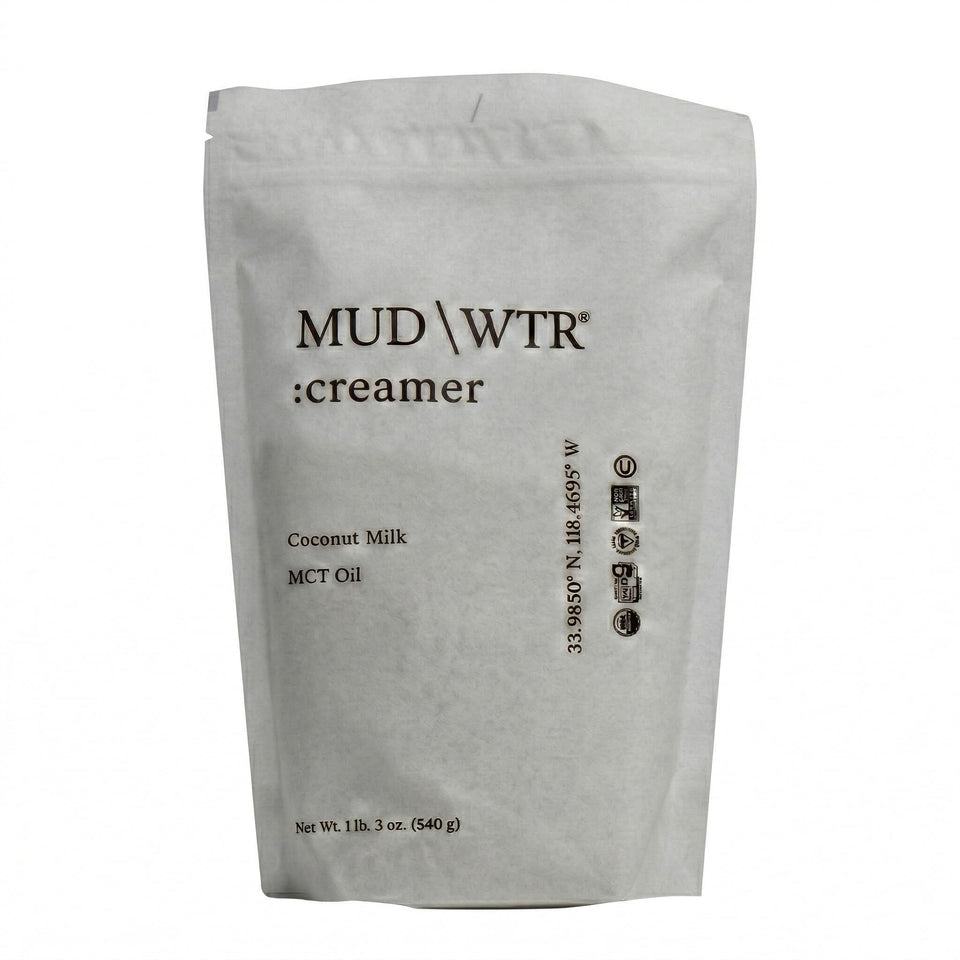 MUDWTR coconut creamer powder bottle for a creamy, dairy-free coffee option with MCT oil