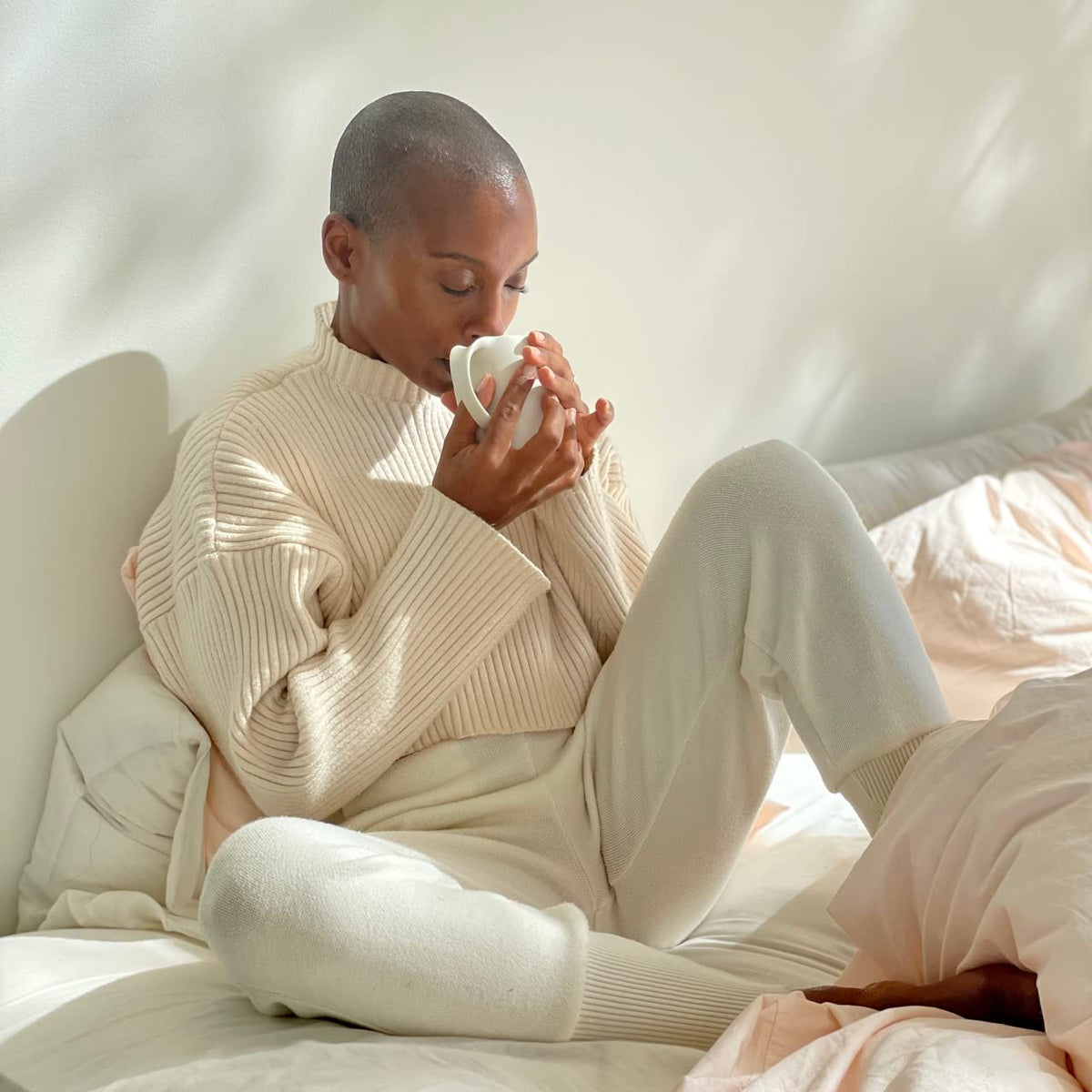 Coffee cup with mudwtr coconut creamer for a rich non-dairy boost