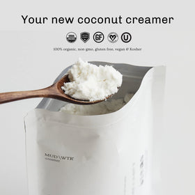 Close-up of ingredients showing MCT oil paired with MUDWTR coconut creamer powder