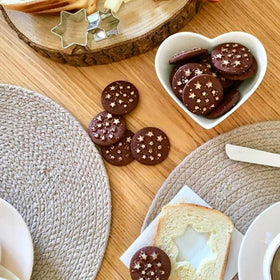 Mulino Bianco Pan di Stelle cocoa biscuits ready to dunk in milk.