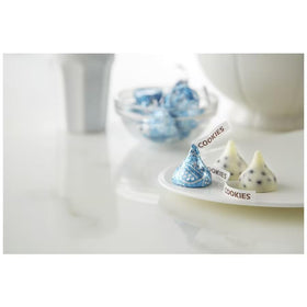 Munchique Cookies & Cream Kisses on a dessert table for decor.